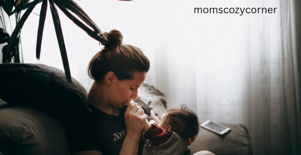 Why do I feel things so deeply – mom sitting alone, holding her newborn baby and gently kissing the baby’s hand, showing tender emotions