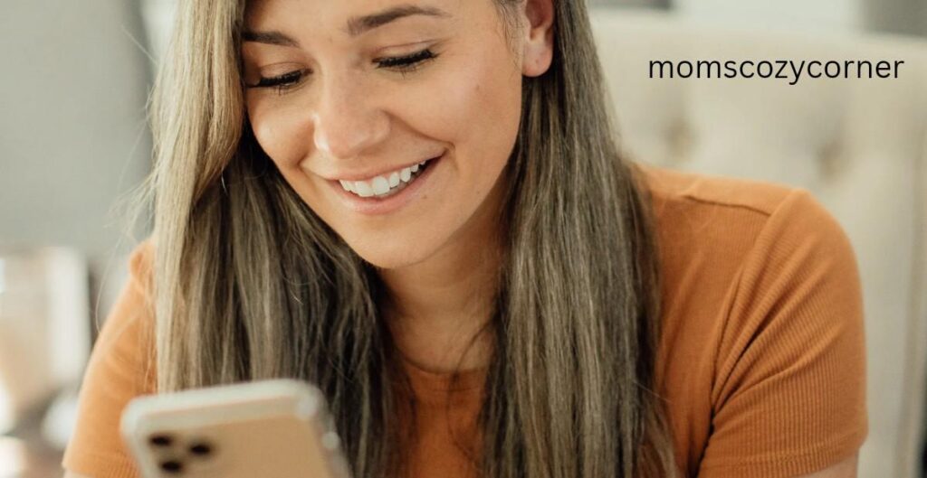 Woman smiling at her phone thinking about someone special