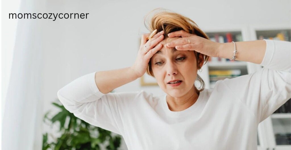 Woman holding her head in stress, representing hidden signs of lost confidence and emotional overwhelm